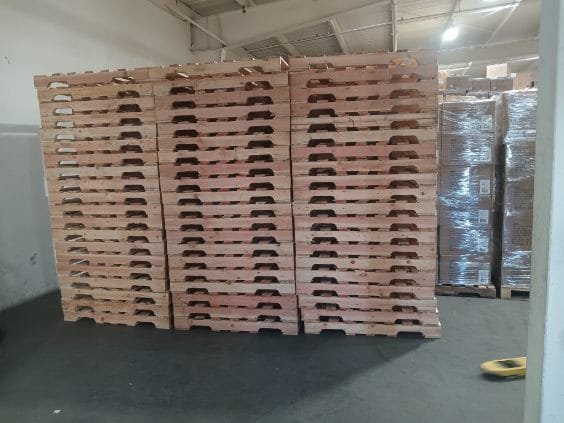 Bro Pallets LLC warehouse with pallets stacked